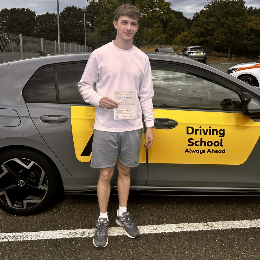Jack holding his practical driving test pass certificate