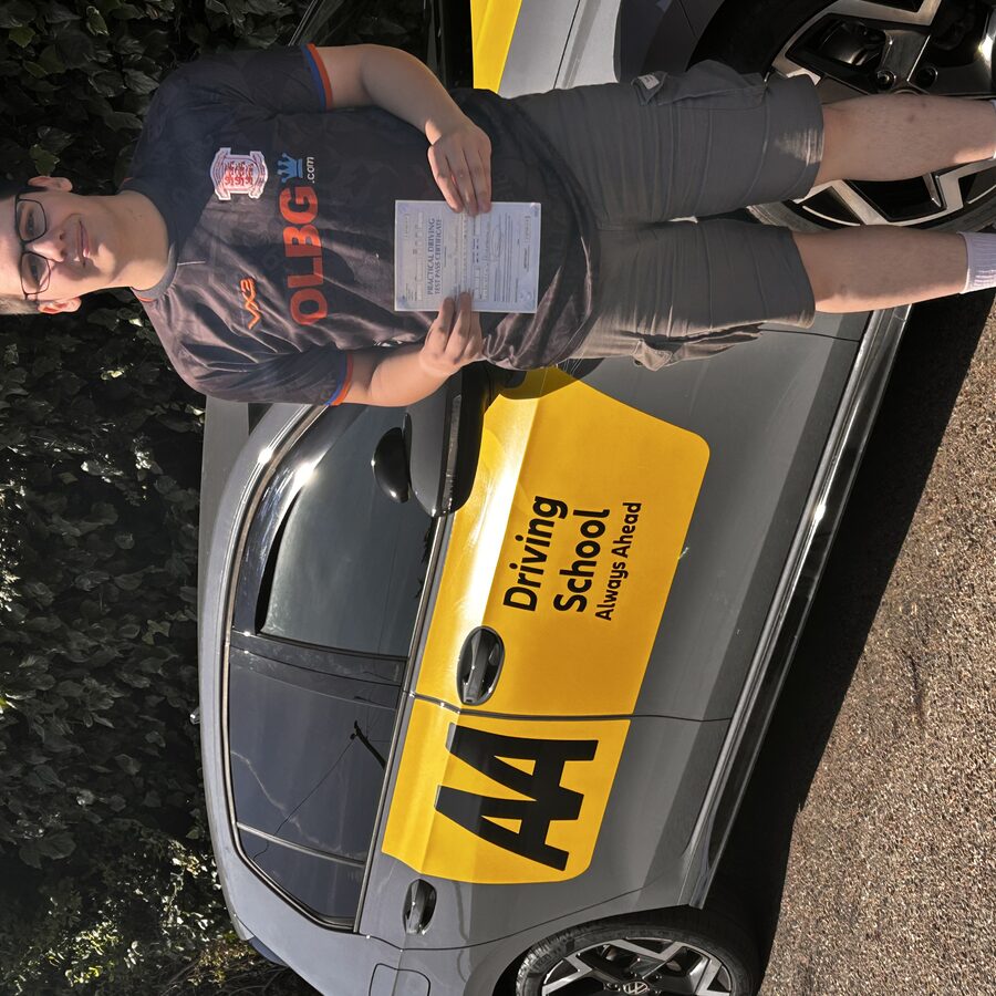 Nick holding his practical driving test pass certificate